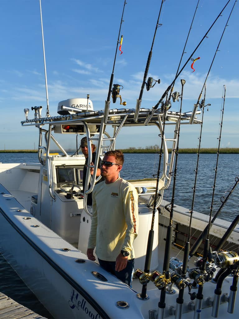 paradise outfitters 36-foot yellowfin boat at the Venice Marina Dock with the captain and deckhand on the boat