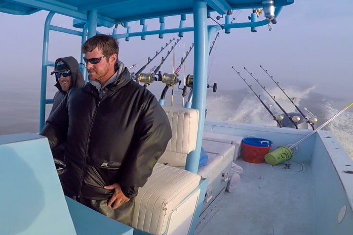 captain scott leger driving the 41-foot custom charter boat in the gulf of mexico